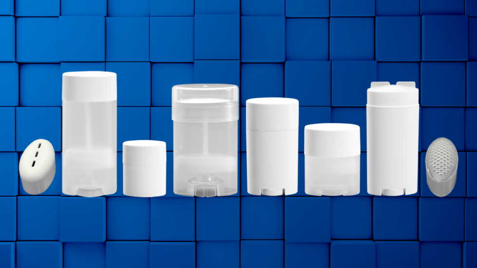 Collection of deodorant tubes on blue background
